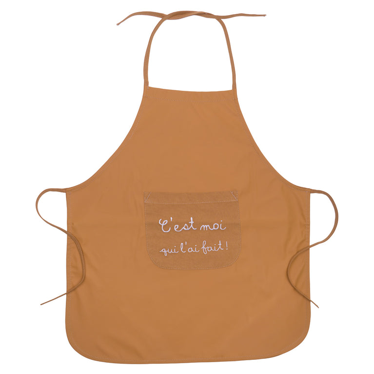 Tablier de cuisine “C’est moi qui l’ai fait” en tissu imperméable camel